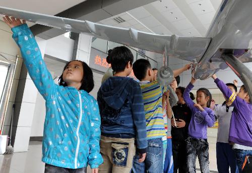 Children celebrate coming holiday at airport