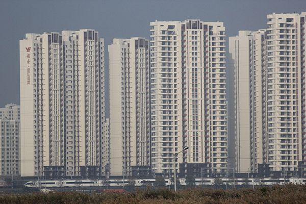 More Chinese cities further restrict housing purchases to cool market