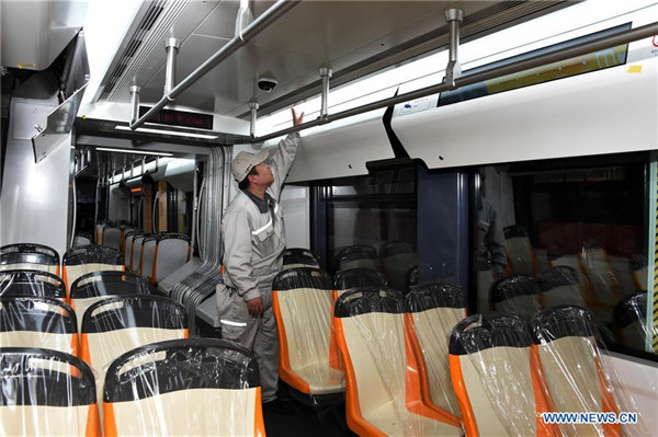 Technicians check tram designed for high-altitude region in Qingdao